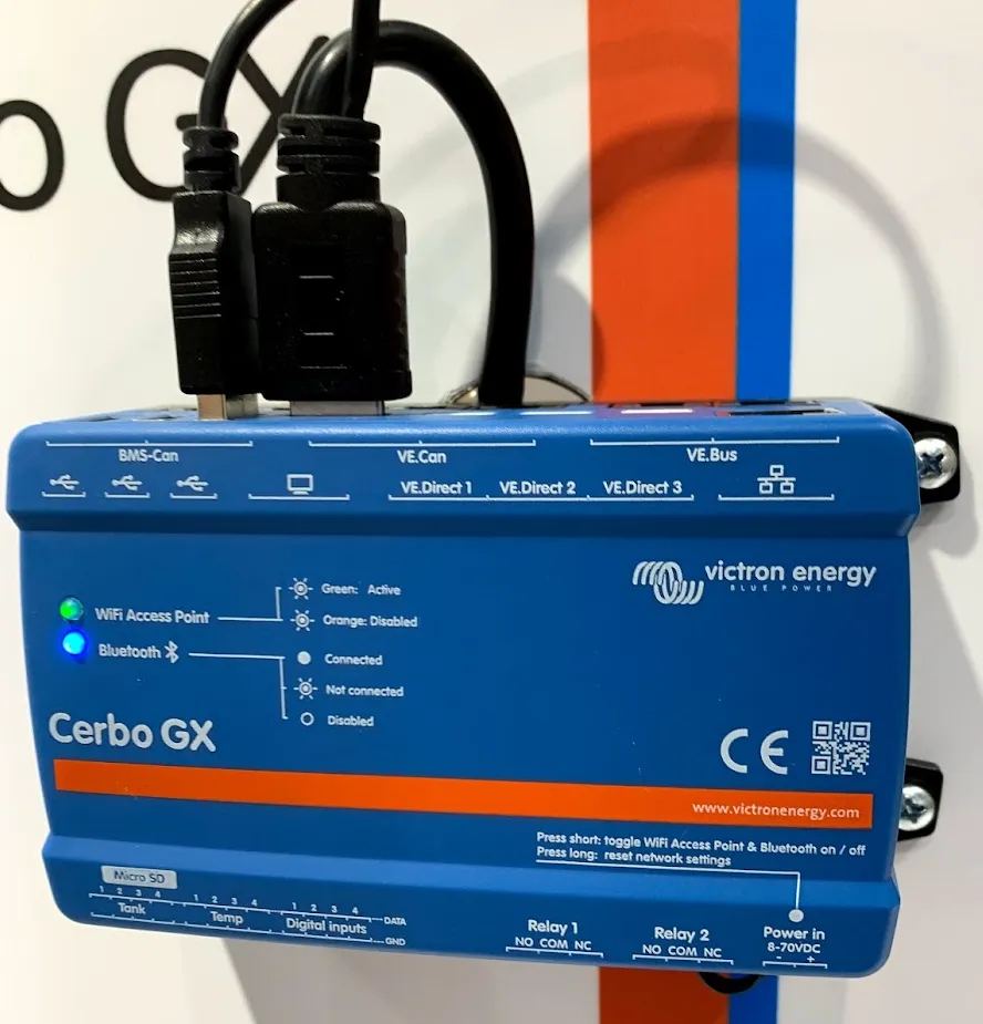 A Victron Cerbo GX with two cables plugged into its top edge; along the bottom edge, strips marked Tank, Temp and Digital inputs, each with channels numbered 1 to 4, and rails marked DATA and GND